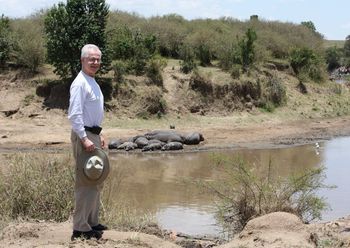 At the Mara River, on the border between Kenya and Tanzania, with sunbathing hippos.