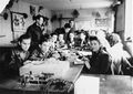 Young men and women attend a radio telegraph class at the ORT school in the Schlachtensee displaced persons persons camp, Berlin, Germany. Students pictured include Murka Bimbad, Lusia Gliklich, George Kupper, Abraham Wasserman, Icka Engelczyn, and ? Zycer.