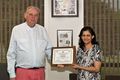 The photo is taken in June 2016; Dr. Ulrich Rohde is handing over the plaque to Dr. Anisha M. Apte for securing first place in IEEE MTT-S IMS SDC (Student Design Contest).